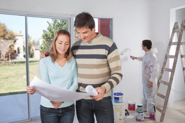 couple looking at home plans